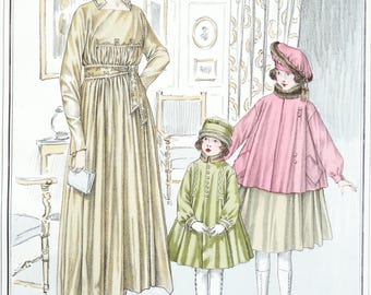 May include: A woman in a beige dress with a belt stands with two girls wearing coats. The girl on the left is wearing a green coat and the girl on the right is wearing a pink coat.