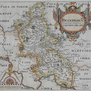 May include: An antique map of Buckinghamshire, England, with detailed borders and text labels. The map is surrounded by a decorative frame with a title cartouche and a compass rose.