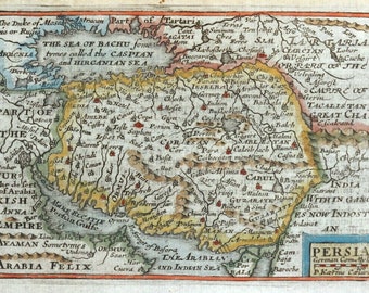 May include: An antique map of Persia, depicting the Caspian Sea, the Sea of Bachu, and the Arabian Sea. The map is hand-drawn and coloured in shades of yellow, green, red, and blue. The map includes text labels for various cities and regions, including Persia, Arabia Felix, and Great Cha.
