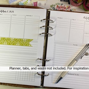 May include: A weekly planner with a green and white washi tape on the left side and a silver pen on the right side. The planner is open to the week of October 2nd and 8th, 2023. The text "Planner, tabs, and washi not included. For inspiration only." is printed at the bottom of the page.