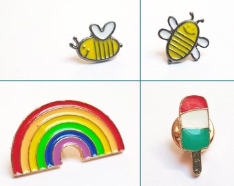 pin's animal : chien bouledogue, pingouin, abeille. métal et émail