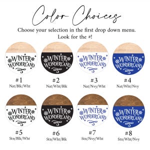 May include: A selection of eight round wooden signs with the text "Winter Wonderland" and snowflake designs. Each sign has a two-tone color scheme, with options including natural wood, black, white, and navy blue. The text "Color Choices" is at the top.