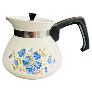 May include: A set of three ceramic mugs with a speckled, matte finish. The mugs are in shades of cream, light gray, and dark gray. Each mug has a simple, minimalist design and a rounded handle. Perfect for coffee or tea.
