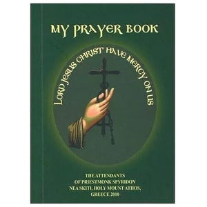 May include: A green book with the title "My Prayer Book" and a circular image of a hand holding a cross with the text "Lord Jesus Christ Have Mercy On Us". The book is published by the attendants of Priestmonk Spyridon, Nea Skiti, Holy Mount Athos, Greece 2010.