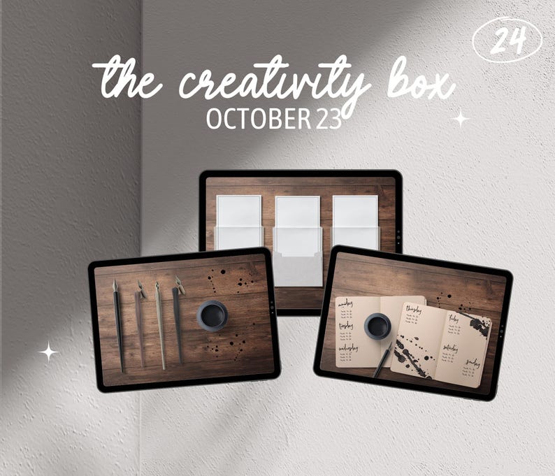 May include: Three digital screens displaying various creative supplies. The first screen shows a wooden surface with four calligraphy pens. The second screen shows three white envelopes on a wooden surface. The third screen displays a notebook with black ink splatters and a calligraphy pen on a wooden surface. The text "the creativity box OCTOBER 23" is at the top of the image.