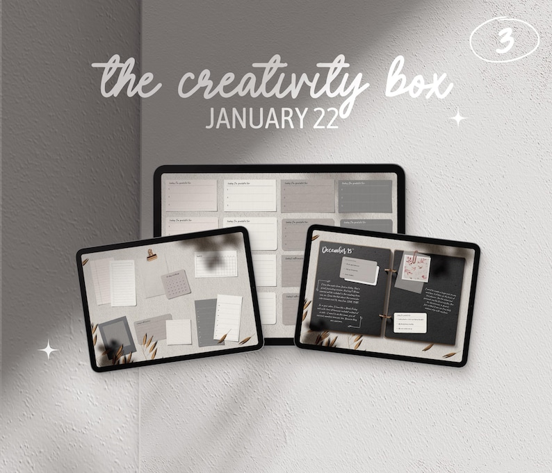 May include: Three digital planners with the text "the creativity box JANUARY 22" on a gray background. The planners are open to show different pages with blank spaces, calendar grids, and lined pages.