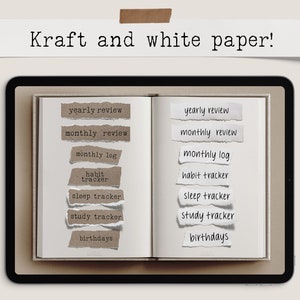 May include: An open notebook with white pages and torn kraft paper labels. The labels include terms like "yearly review," "monthly review," and "habit tracker." The text "Kraft and white paper!" is above the notebook.