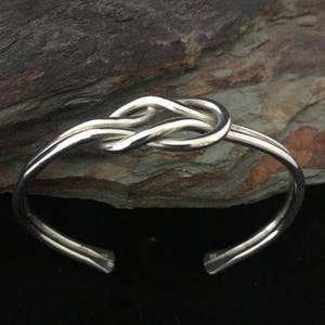 Sterling silver lover&#39;s knot cuff bracelet.