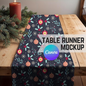 May include: A dark blue table runner with a festive pattern of ornaments, holly, and snowflakes. The text "TABLE RUNNER MOCKUP" and the Canva logo are visible. A lit red candle and pine branches are on the wooden table.