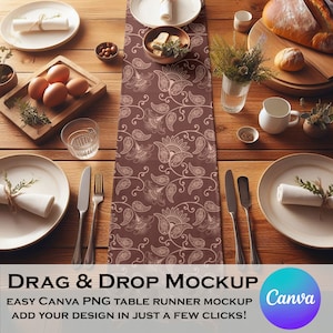 May include: A brown table runner with a paisley pattern. The runner is on a wooden table with plates, silverware, and other table decor. The text "DRAG & DROP MOCKUP" is at the bottom of the image. The text "EASY CANVA PNG TABLE RUNNER MOCKUP" is below the first line of text. The text "ADD YOUR DESIGN IN JUST A FEW CLICKS!" is below the second line of text. The Canva logo is in the bottom right corner of the image.