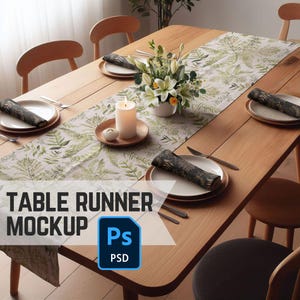 May include: A table runner mockup featuring a white linen table runner with a green and white floral pattern. The runner is placed on a wooden table with a white candle and a vase of white flowers. The table is set with two place settings, each with a white plate, a black napkin, and silverware.