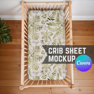 May include: A white crib sheet with a green leafy pattern. The sheet is in a wooden crib with a white background. The text "CRIB SHEET MOCKUP Canva" is visible in the image.