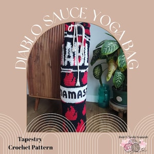 May include: Crocheted yoga bag with the text "DIABLO SAUCE YOGA BAG". The bag is primarily black with red flame designs and white lettering. The top has a drawstring closure. The words "MAMAS" and "ADI" are visible.