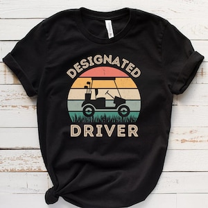 指定ドライバーユニセックスTシャツ、ゴルフカートジャージTシャツ、ゴルファー半袖トップス、男性向けゴルフギフトソフトTシャツ、レトロなダメージ加工サンセット