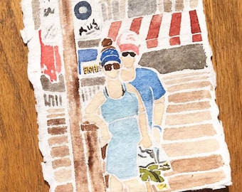 May include: A watercolor painting of a couple standing on a street with a red and white striped awning above them. The woman is wearing a blue dress and the man is wearing a blue shirt. The painting is on textured paper.