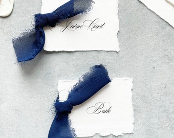 handmade paper place cards with ribbon, printed place cards with meal choice, navy wedding decor, name cards for table setting, deckled edge