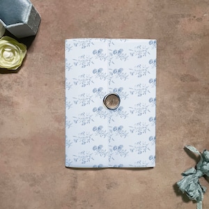 blue vellum for invitations, dusty blue wedding invitation wrap flowers, floral invitation jacket, light blue vellum sheet, vellum wrap