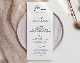 May include: A white menu card with black text listing the menu for a wedding reception on July 22, 2025. The menu includes: First - Linguine with Prawns and Pachino Tomatoes, Second - Sea Bream Fillet Sauteed with White Wine, Garlic, Cherry Tomatoes, Parsley, Black Olive and Capers, Third - Beef Entrecote with Rocket Salad and Parmesan Shavings on Baked Potatoes, Dessert - Coffee Mousse with Chocolate Sauce, Coffee Mousse with Whipped Cream and Hazelnuts.
