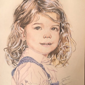 May include: A pencil drawing of a young girl with long, curly brown hair. She is wearing a light pink shirt and blue overalls. The drawing is signed "Julie Naomi".