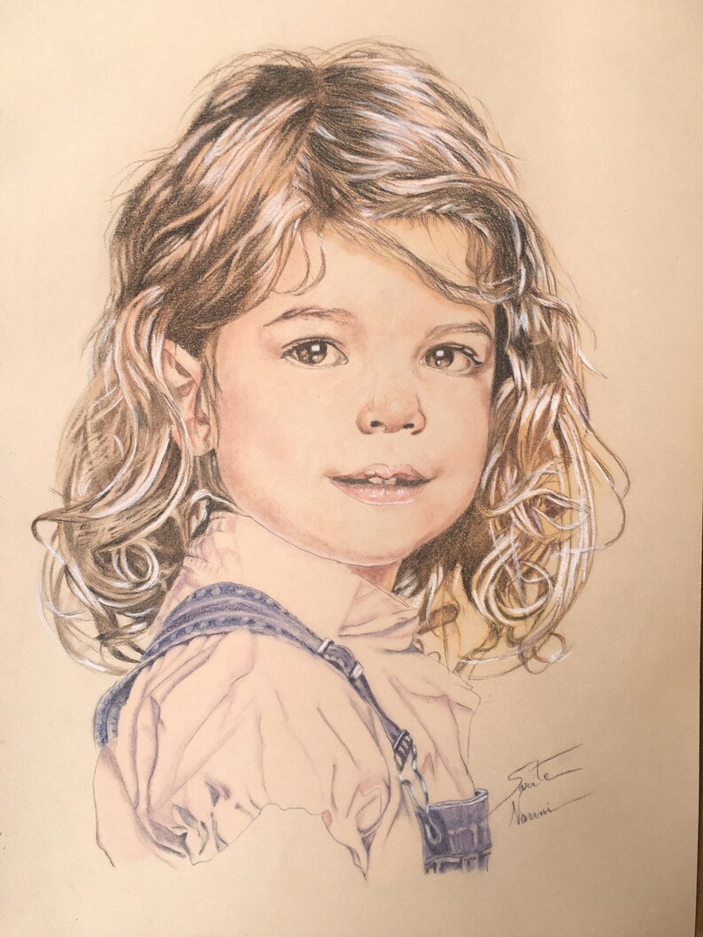 May include: A pencil drawing of a young girl with long, curly brown hair. She is wearing a light pink shirt and blue overalls. The drawing is signed "Julie Naomi".