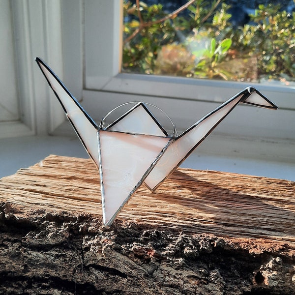 A 3D Stained Glass Origami Crane brings peace, good fortune & get well wishes. This hanging bird can also sit on a window ledge or bookcase.