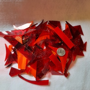 Red and orange stained glass scraps for sale from Graphix Glass on Etsy. Great for regular mosaics or glass on glass mosaics.
www.graphixglass.com