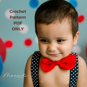 May include: A crochet pattern PDF for a red bow tie. The pattern is available for download only. The image shows a baby wearing the bow tie.