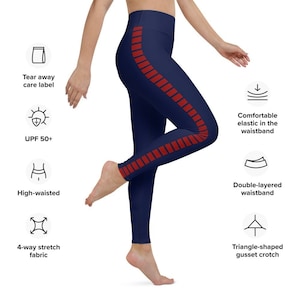 May include: Navy blue leggings with a red stripe down the side. The leggings have a high waistband and a double-layered waistband for comfort. The fabric is 4-way stretch and has a triangle-shaped gusset crotch.
