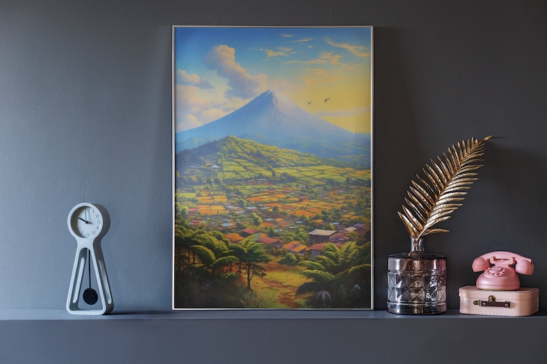 May include: A framed painting of a mountain landscape with a village in the foreground. The mountain is a vibrant blue and the sky is a light blue with white clouds. The village is a mix of green and brown buildings.