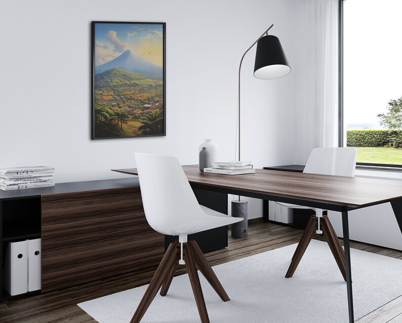May include: A modern home office with a wooden desk, two white chairs, and a black floor lamp. A framed painting of a mountain landscape hangs on the wall.