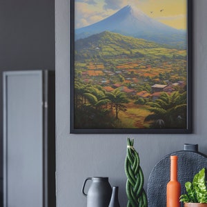 May include: A framed painting of a mountain landscape with a village in the foreground. The mountain is blue and white, and the sky is blue with white clouds. The village is green and brown, with houses and trees.
