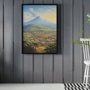 May include: A framed painting of a mountain landscape with a village in the foreground. The painting is set against a gray wall with a potted plant and a white chair to the right.