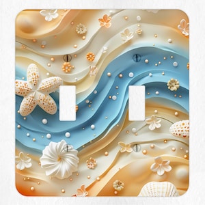 May include: A light blue and beige light switch cover with a seashell and starfish design. The design features a wavy pattern reminiscent of ocean waves.