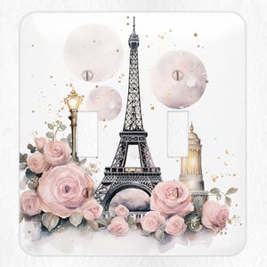 May include: A watercolor illustration of the Eiffel Tower in Paris, France. The tower is surrounded by pink roses and a street lamp. The background is a light pink with gold glitter.