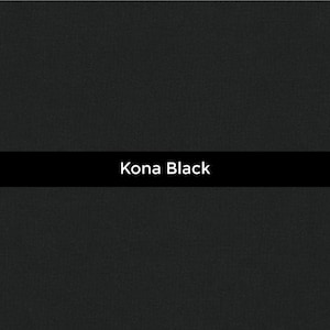 May include: A plain black background with the words "Kona Black" in white, displayed in a black horizontal bar. The surface has a slightly textured finish.