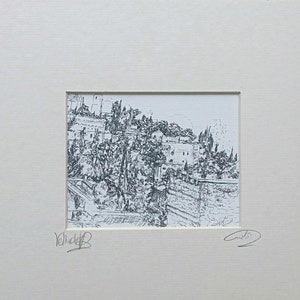 May include: Black and white ink drawing of a hillside village with buildings and trees. The drawing is signed "Volk" and "G.N."