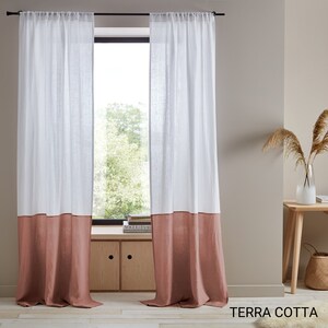 May include: Two white linen curtains with a terracotta colored bottom panel. The curtains are hung on a black rod and are in front of a window. The text "TERRA COTTA" is visible at the bottom of the image.