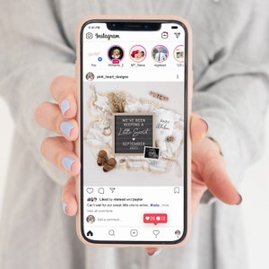 May include: A smartphone screen displaying an Instagram post announcing a pregnancy. The post features a chalkboard sign with the text "We've Been Keeping A Little Secret September 2023" and a baby onesie with the text "Baby Weben".