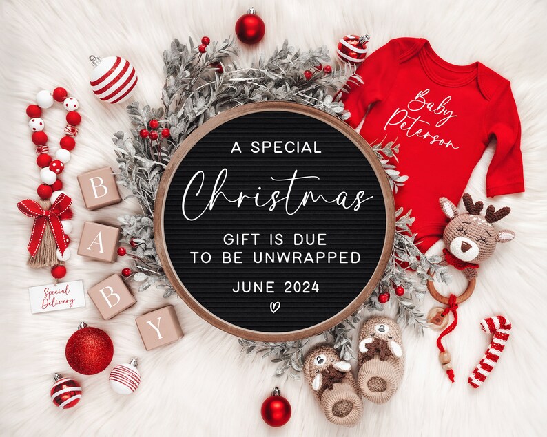 May include: A black letter board with the text "A Special Christmas Gift is Due to be Unwrapped June 2024" surrounded by red and white Christmas decorations, including ornaments, a candy cane, and a baby onesie with the text "Baby Peterson".