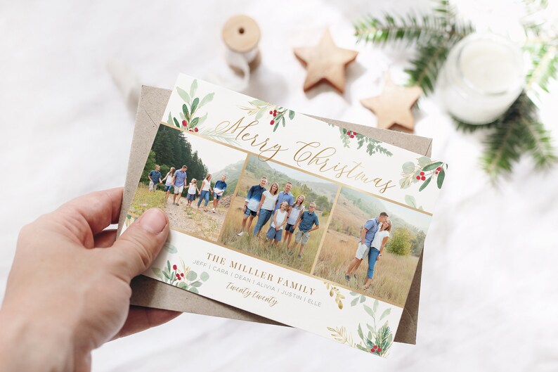 May include: A Christmas card with a gold and white background featuring a watercolor design of green leaves and red berries. The card has three photos of a family, with the text "Merry Christmas" and "The Miller Family" in gold lettering.