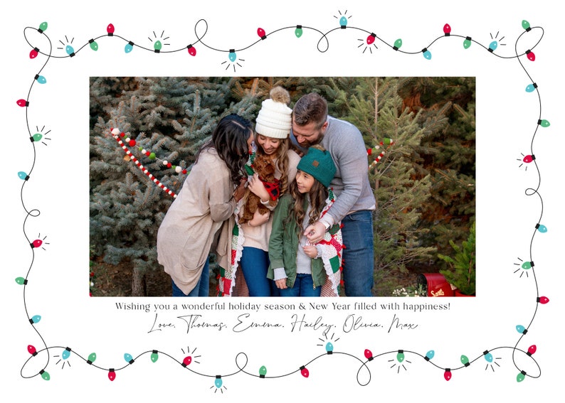 May include: A family of five, including a dog, stand in front of a Christmas tree lot. They are smiling and looking at the camera. The text "Wishing you a wonderful holiday season & New Year filled with happiness! Love. Thomas. Emena. Hailey, Olivia. Max" is written below the image.