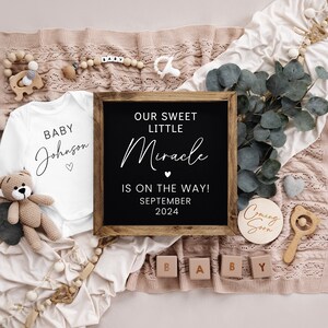 May include: A baby announcement with a white onesie that says "Baby Johnson" and a chalkboard sign that says "Our Sweet Little Miracle is on the way! September 2024". There are also wooden blocks that spell out "BABY" and a wooden sign that says "Coming Soon".