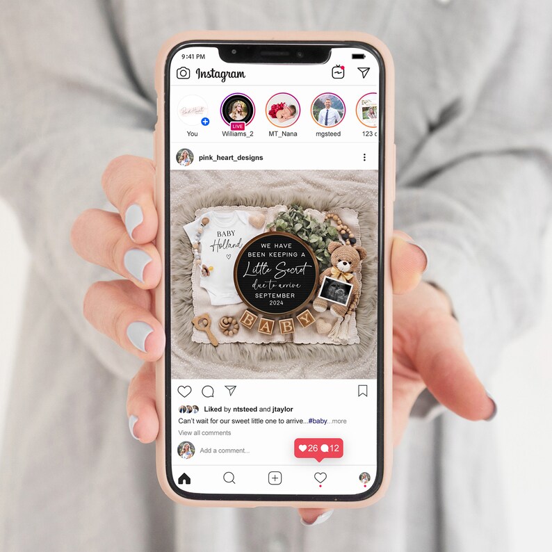 May include: A phone displays a baby announcement on Instagram. The announcement includes a white onesie, a teddy bear, and a sign that reads "We have been keeping a little secret due to arrive September 2024." Wooden blocks spell out "BABY."