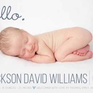 May include: A newborn baby boy, Jackson David Williams, is sleeping on a white blanket. He is 7 pounds and 8 ounces, and 21 inches long. The text "hello." is written in blue above the baby. The date "Feb 15 2019" is written in a circle in the bottom right corner of the image.