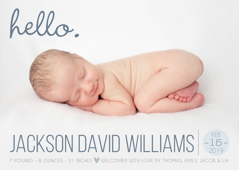 May include: A newborn baby boy, Jackson David Williams, is sleeping on a white blanket. He is 7 pounds and 8 ounces, and 21 inches long. The text "hello." is written in blue above the baby. The date "Feb 15 2019" is written in a circle in the bottom right corner of the image.