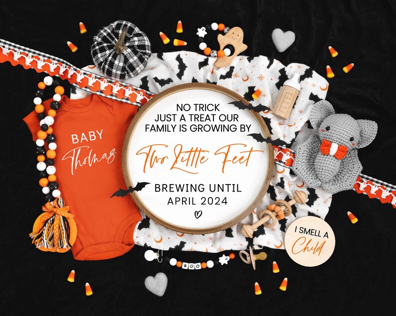 May include: A Halloween-themed baby announcement with a white and black pumpkin, a crocheted bat, a wooden rattle, and a baby onesie with the text "Baby Thomas". The announcement also includes a wooden sign with the text "No trick just a treat our family is growing by two little feet brewing until April 2024".