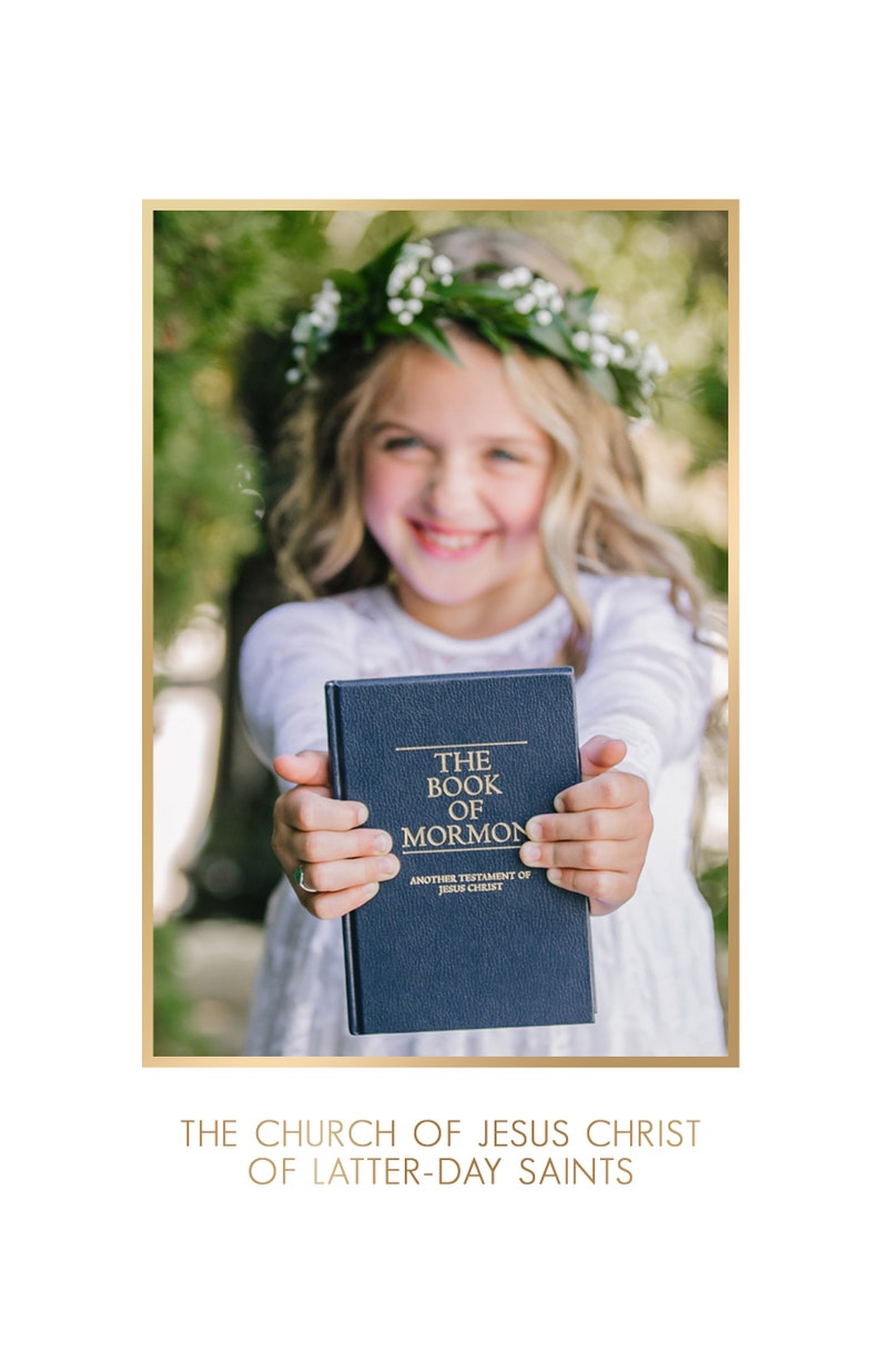 May include: A young girl wearing a flower crown holds a blue book titled "The Book of Mormon, Another Testament of Jesus Christ".
