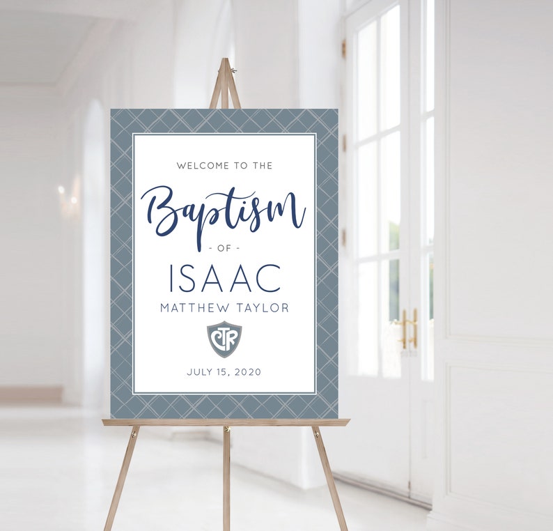 May include: A blue and white welcome sign for a baptism with the text "Welcome to the Baptism of Isaac Matthew Taylor" and the date "July 15, 2020".