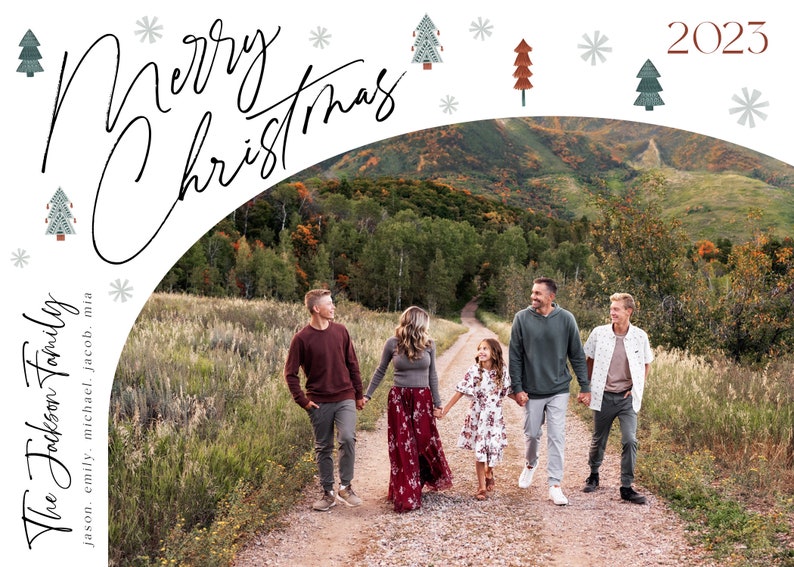 May include: A family of five walks down a path in a forest setting. The family is dressed in casual clothing and smiling. The text "The Jackson Family" and "Merry Christmas 2023" is written on the image.