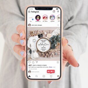 May include: A close-up of a baby announcement on a phone screen. The announcement features a white onesie with the name "Taylor" on it, a wooden sign that says "Our Next Great Adventure Begins February 2024", and a variety of other baby-themed items.